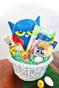 Assembled Easter basket for kids with art supplies, Pete the Cat themed items, and Easter "grass"